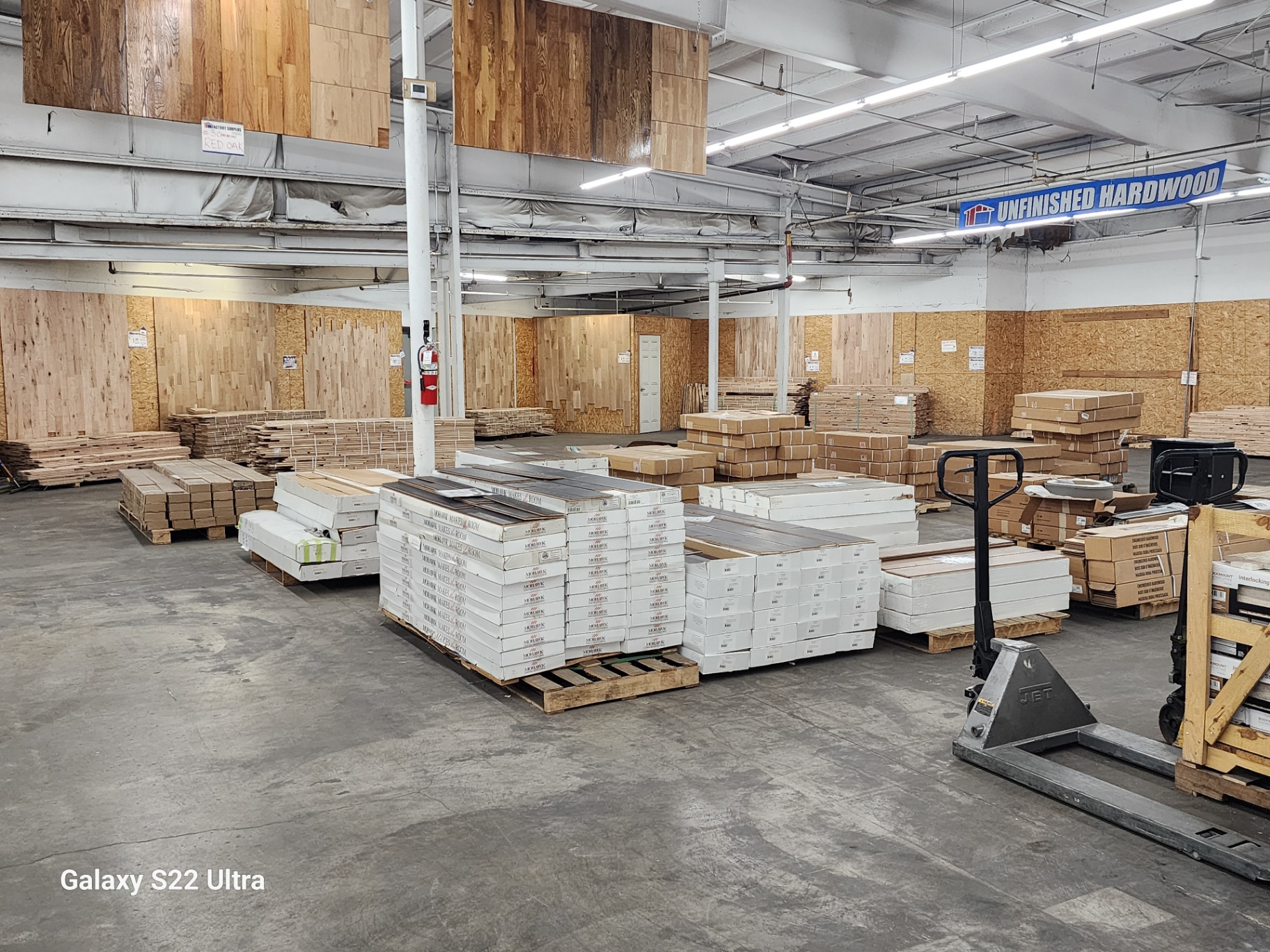 Unfinished hardwood flooring section at Factory Surplus
