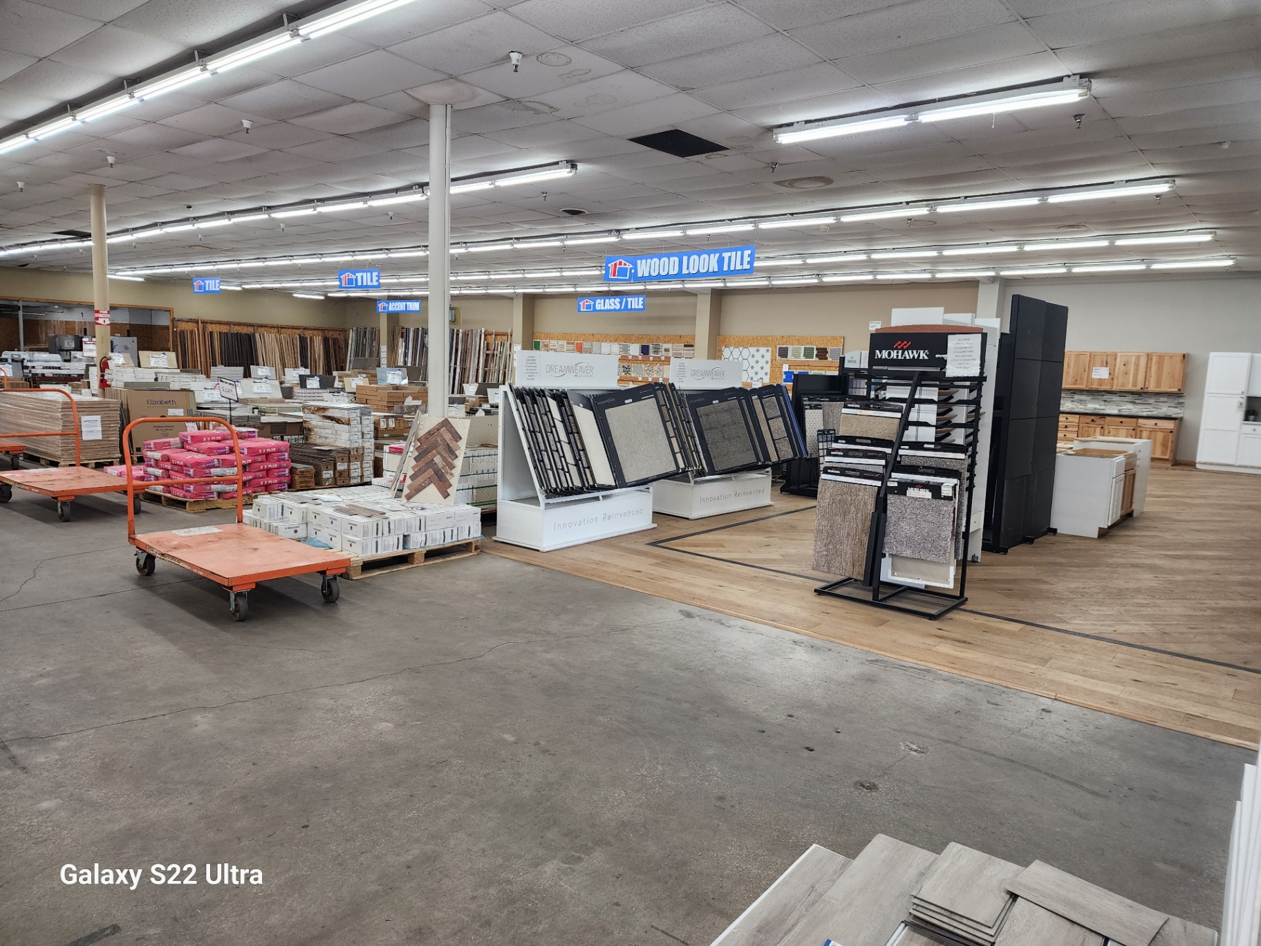 Tile, wood, and cabinet displays inside Factory Surplus