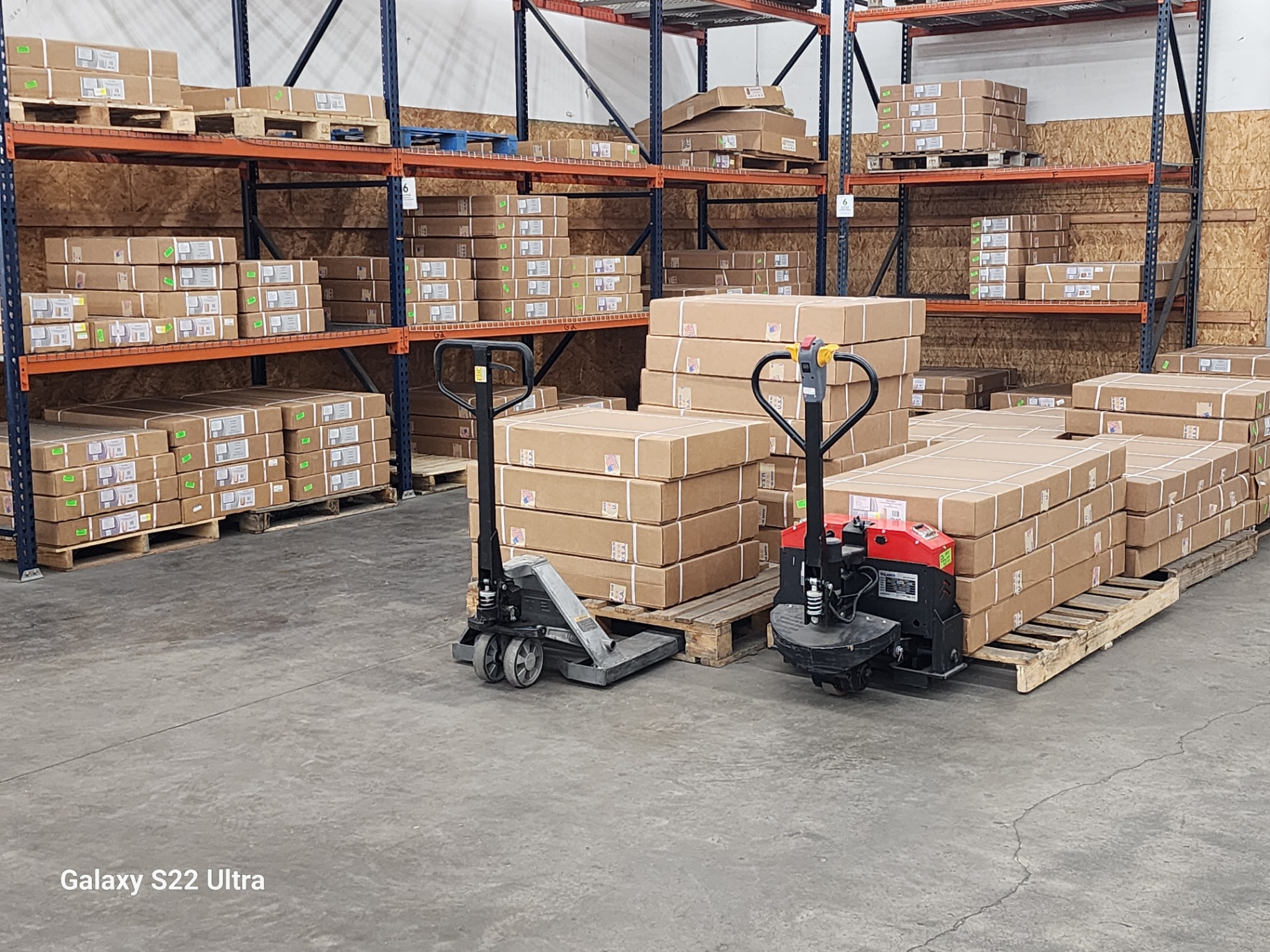 Pallet racking and pallet jacks on the Factory Surplus warehouse floor